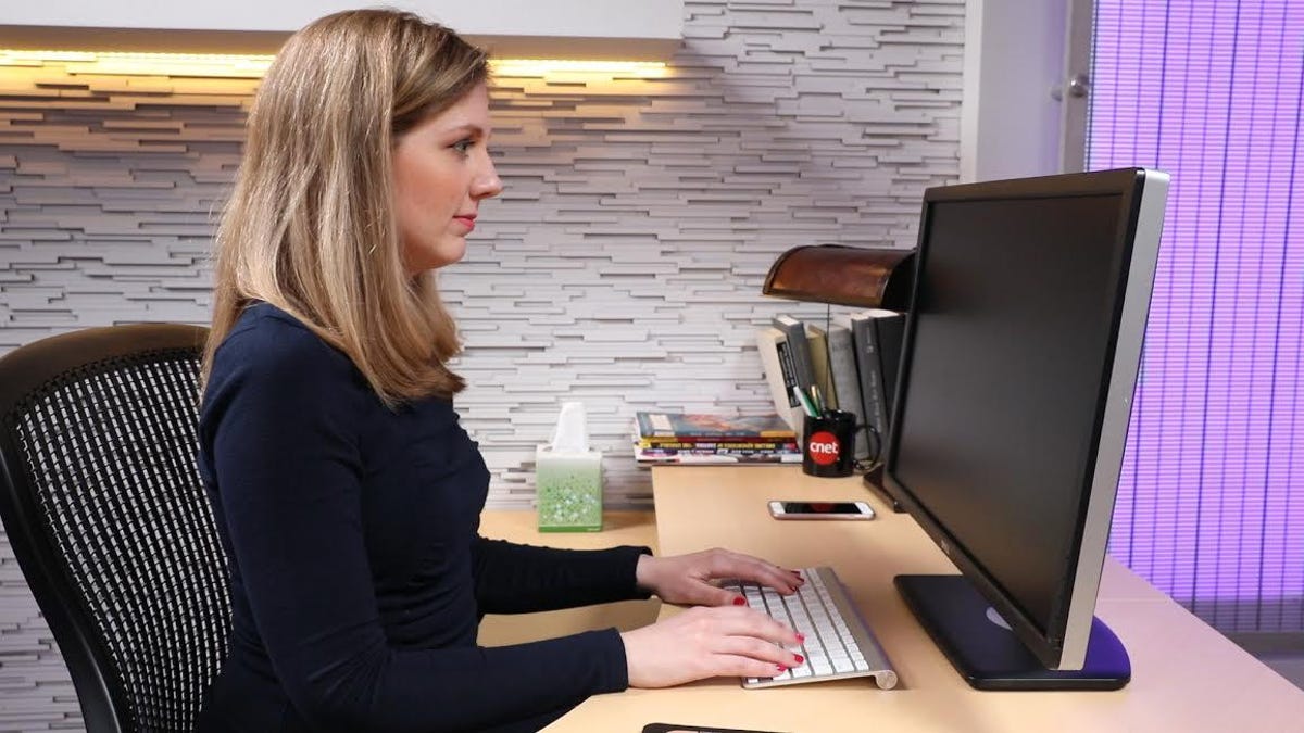 Lady siting at a computer desk