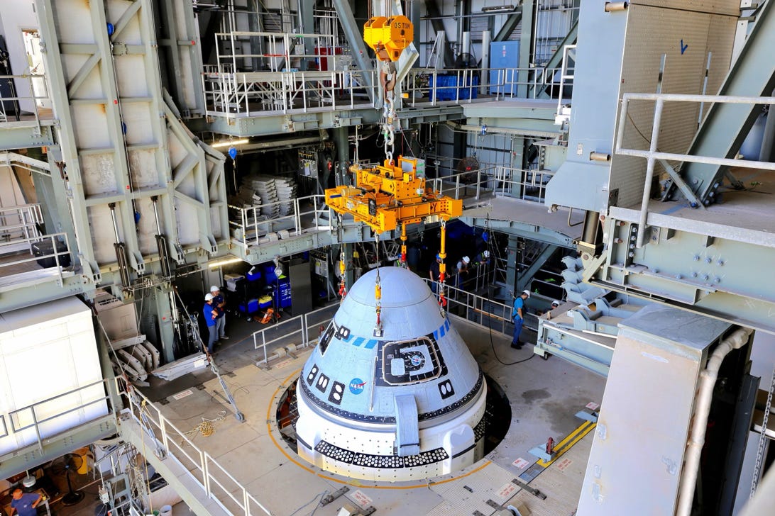 Boeing's CST-100 Starliner spacecraft is secured atop a United Launch Alliance Atlas V rocket at the Vertical Integration Facility at Space Launch Complex-41 at Florida's Cape Canaveral Space Force Station on July 17, 2021.
