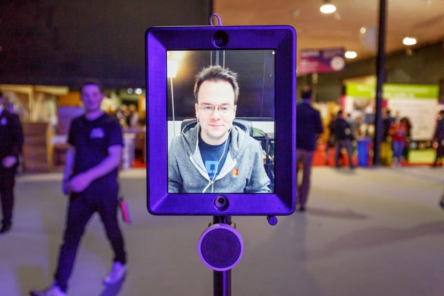 Double Robotics CEO David Cann appear on the screen of Double telepresence robot at Web Summit 2015.​
