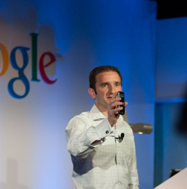 Google's Mario Queiroz holding the new Nexus One smartphone.