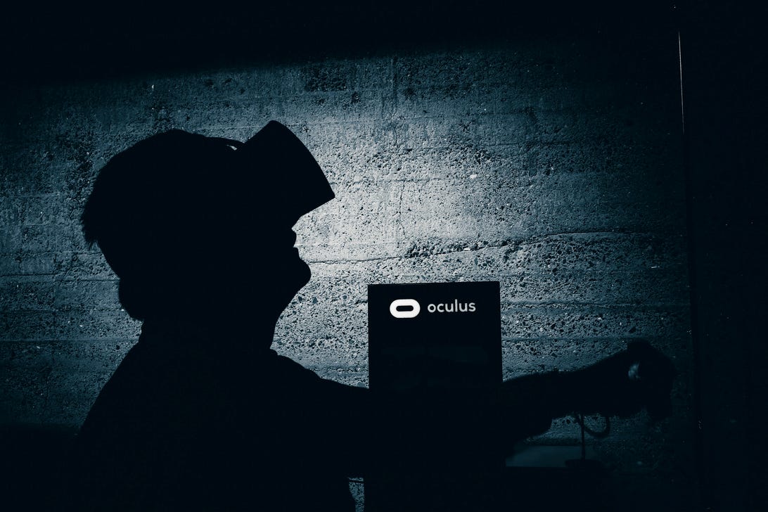 A silhouette of a person in a VR headset