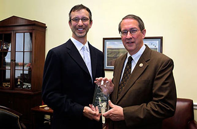 Incoming Judiciary chairman Bob Goodlatte receiving the 2011 President's Award from another pro-SOPA music industry group, which praised him for his "ongoing efforts to curb digital theft"