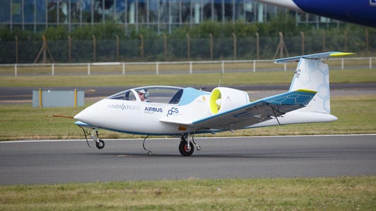 The Airbus E-Fan lands at the Farnborough International Airshow in the UK. It's got a central wheel and smaller ones on the wings. The main wheel also can drive the plane more efficiently for taxing and the initial acceleration of takeoff.