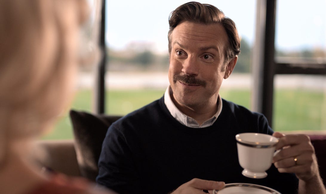 Ted Lasso with a teacup
