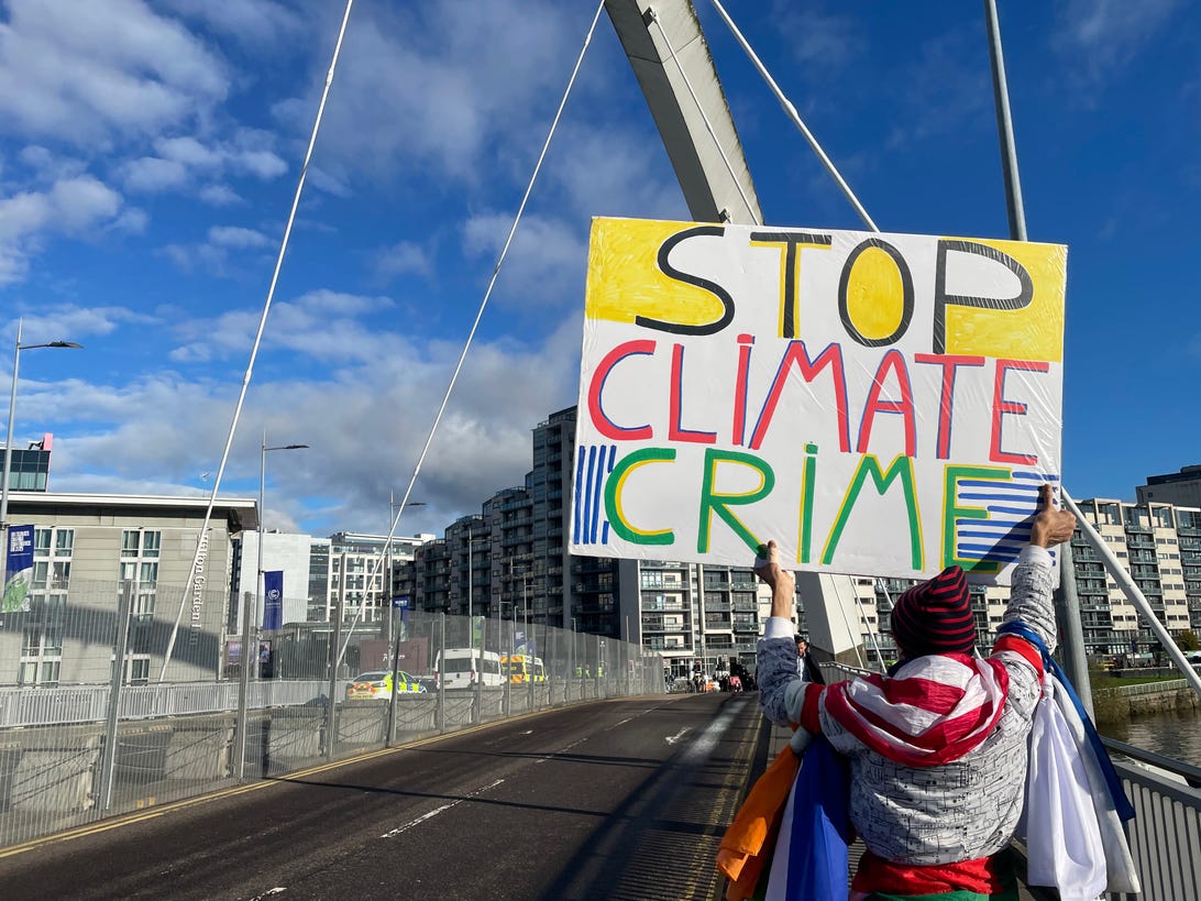 A protester outside the COP26 blue zone.