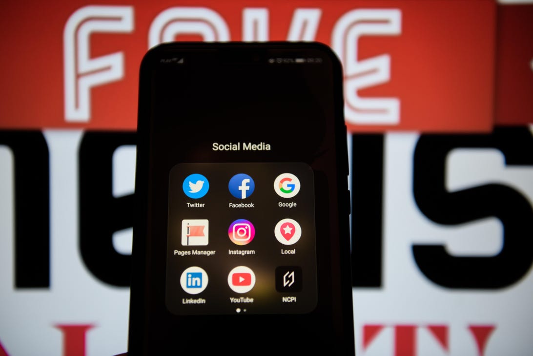 Social media logos are seen on an Android mobile phone