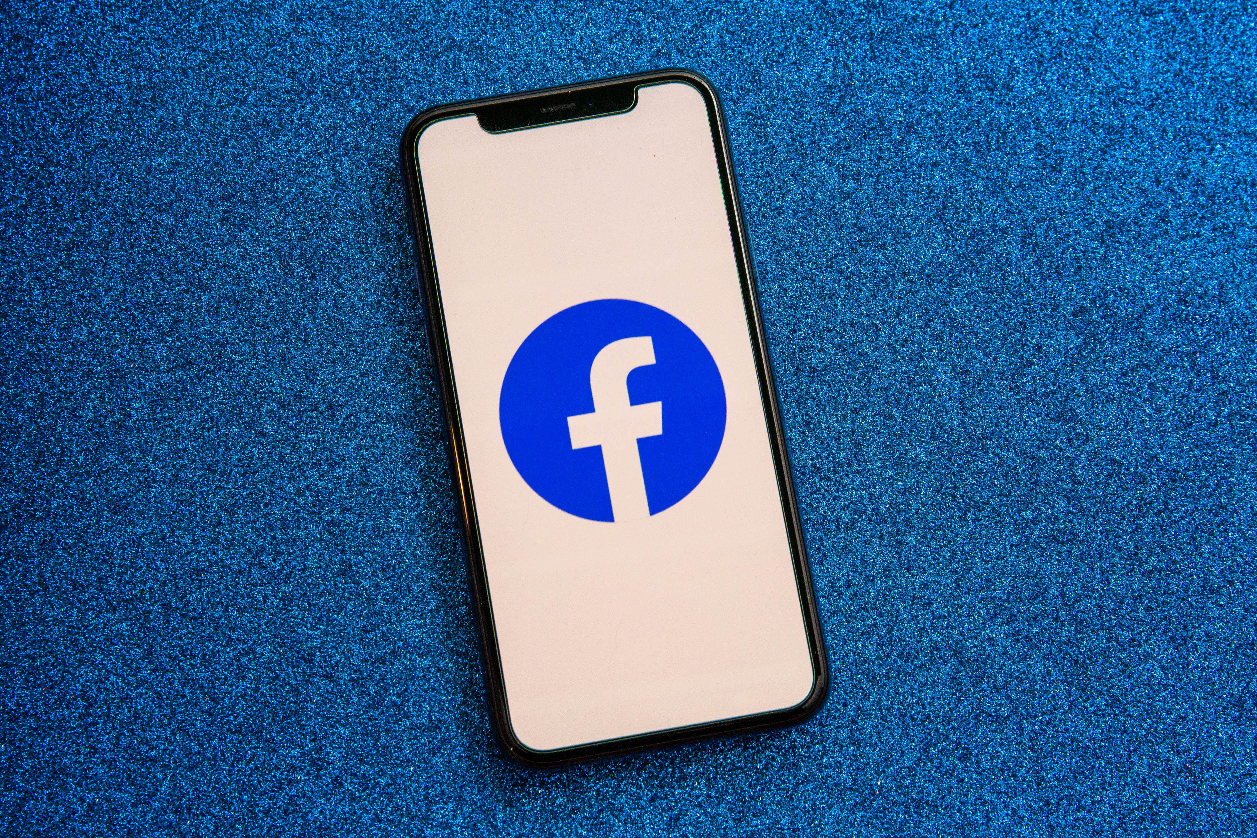 001-facebook-app-logo-on-phone-2021