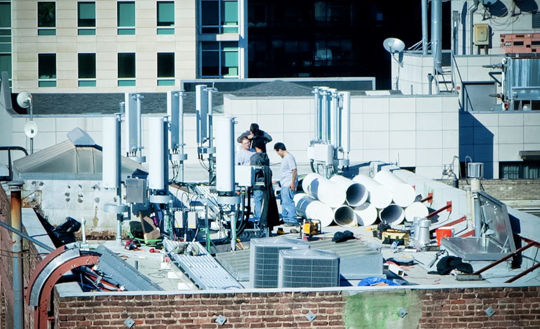 Cell towers from an unknown service provider being installed on the roof of a building in downtown San Francisco.