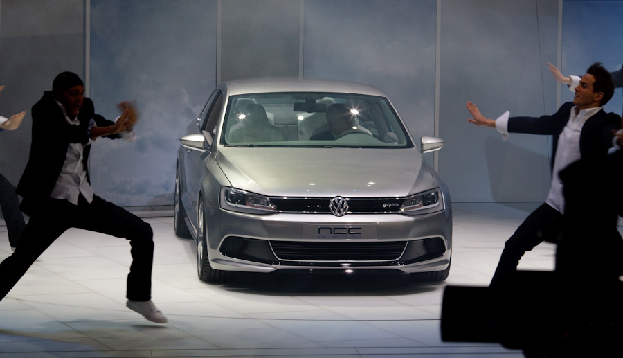 A dance troupe coyly shuffled screens around to gradually reveal VW's New Compact Coupe seen at the Detroit auto show.