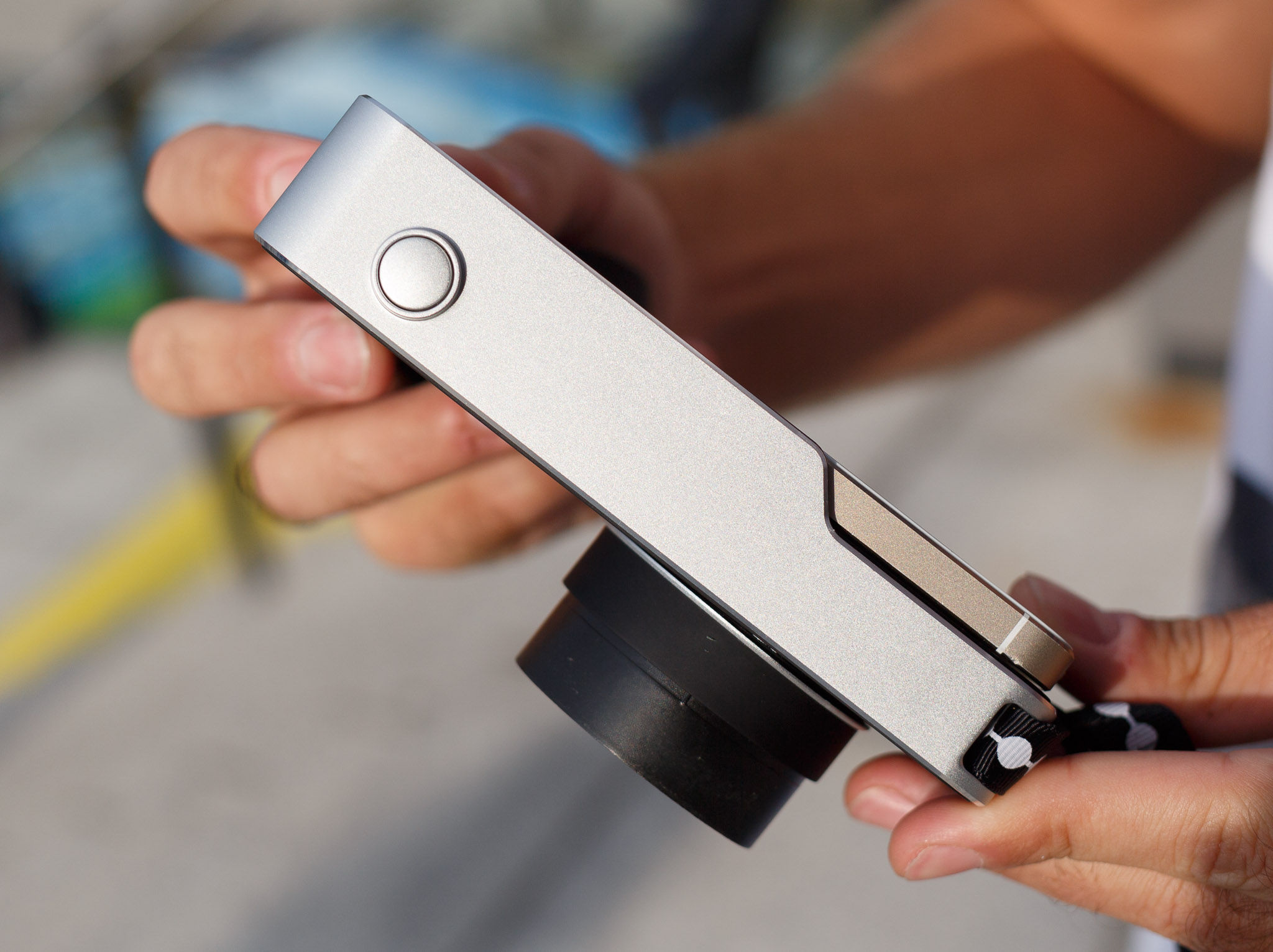 The Relonch Camera, shown here with an iPhone slotted in, has just a single shutter-release button for simple operation. This is an engineering prototype of the camera that doesn't actually work.