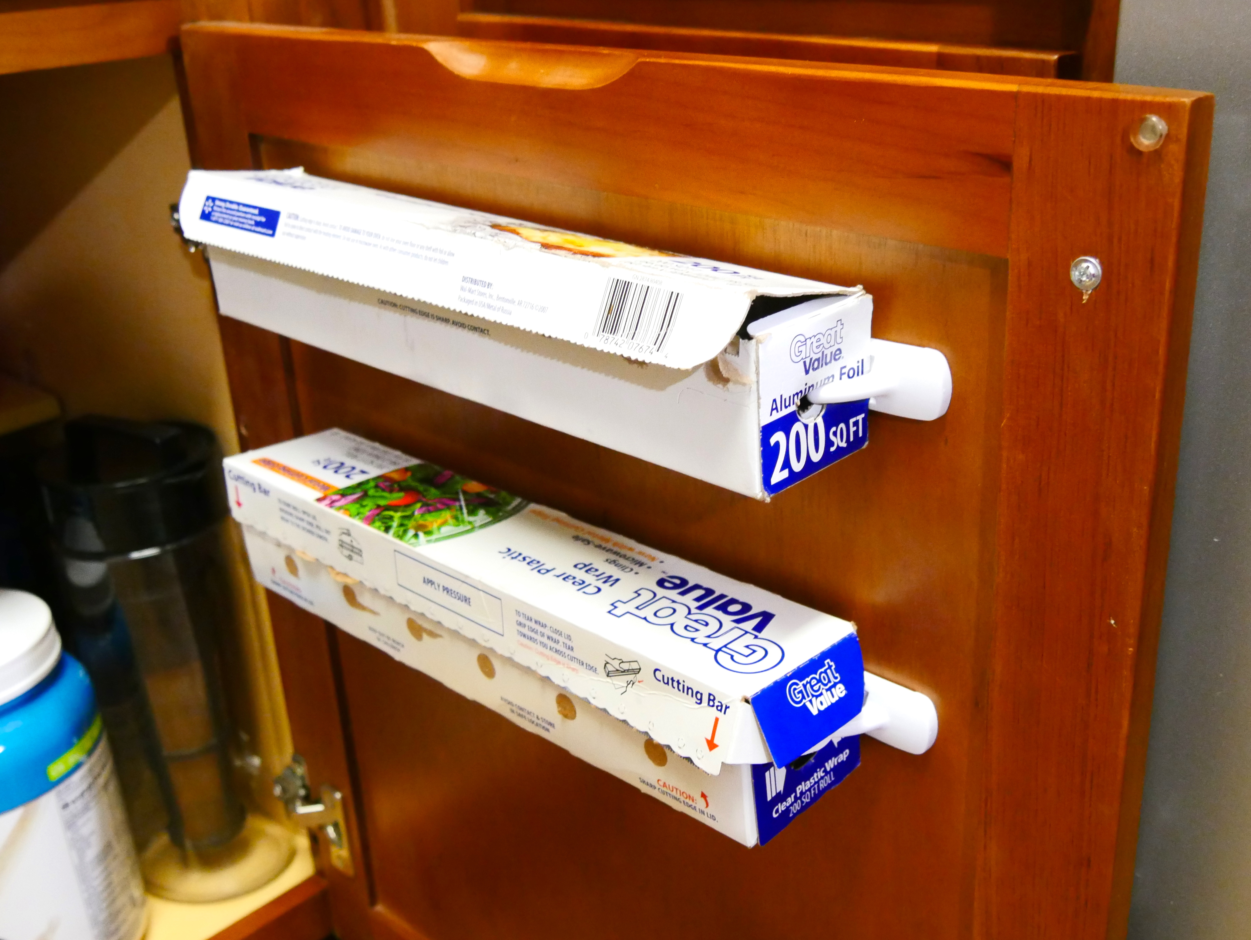 Hang aluminum foil and cling wrap inside a cabinet for easier access - CNET
