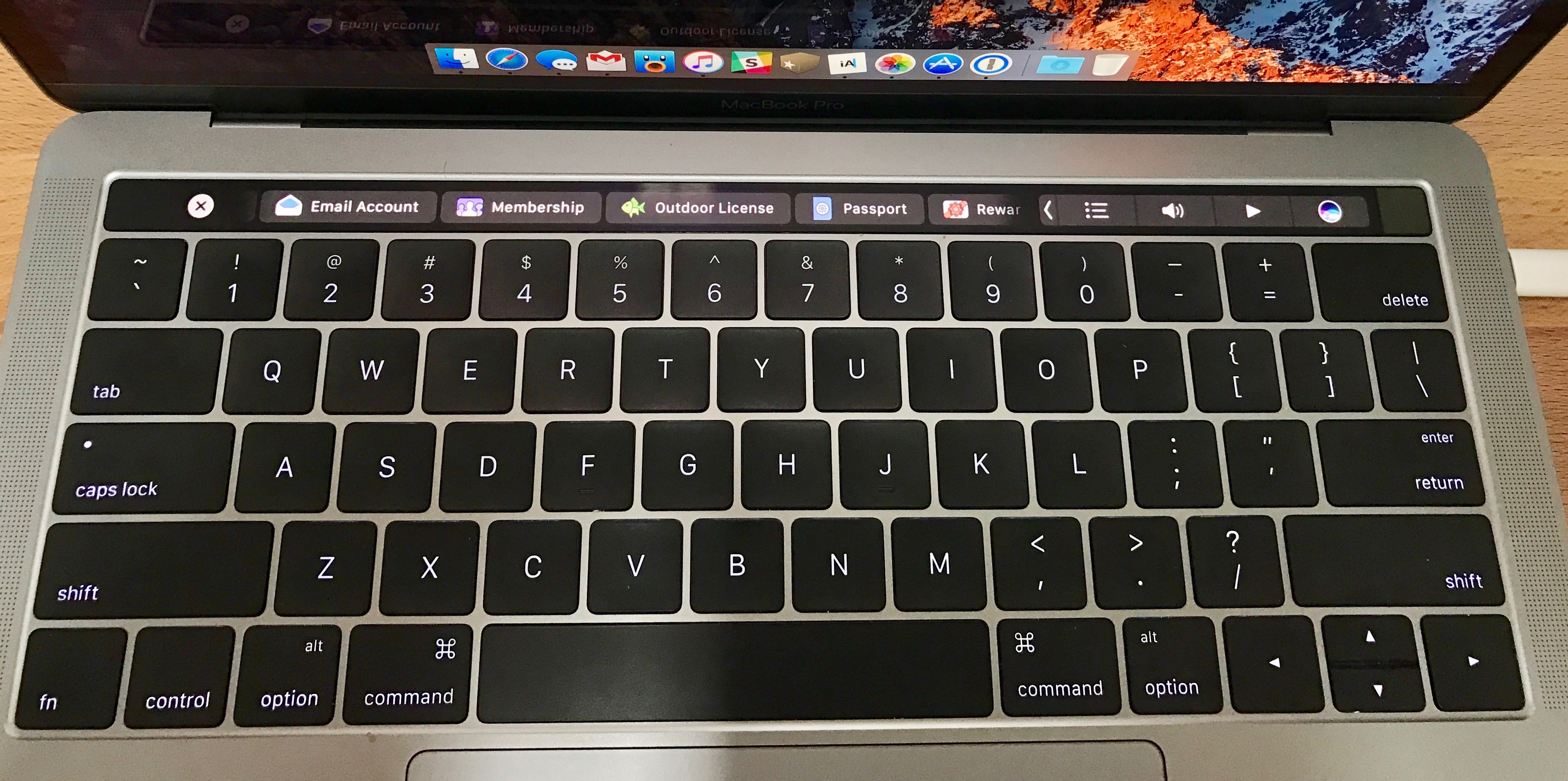 The MacBook Pro with Touch Bar has a trackpad that's bigger than your  entire phone - CNET