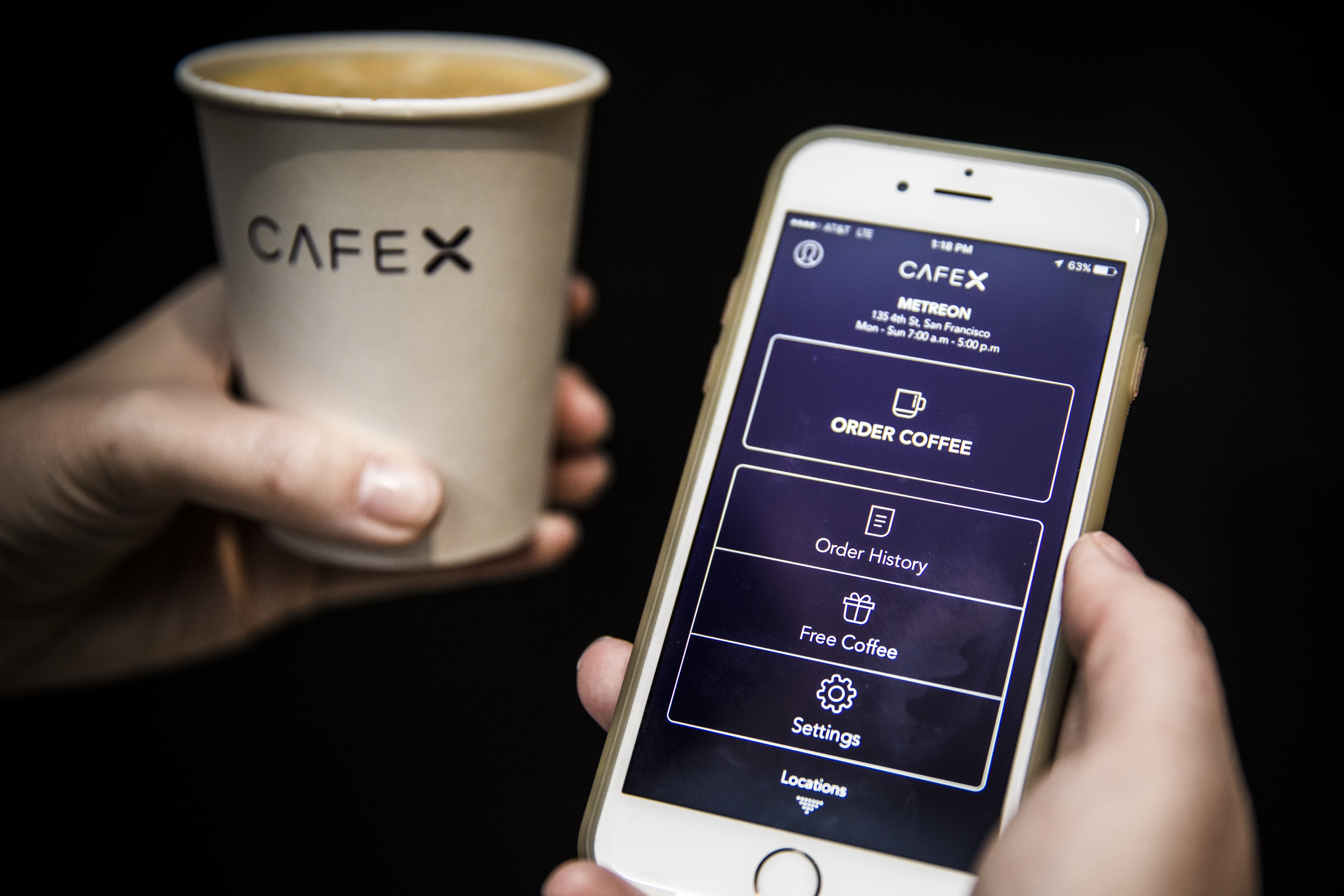 You order Cafe X ​coffee with an app or a tablet at the cafe.