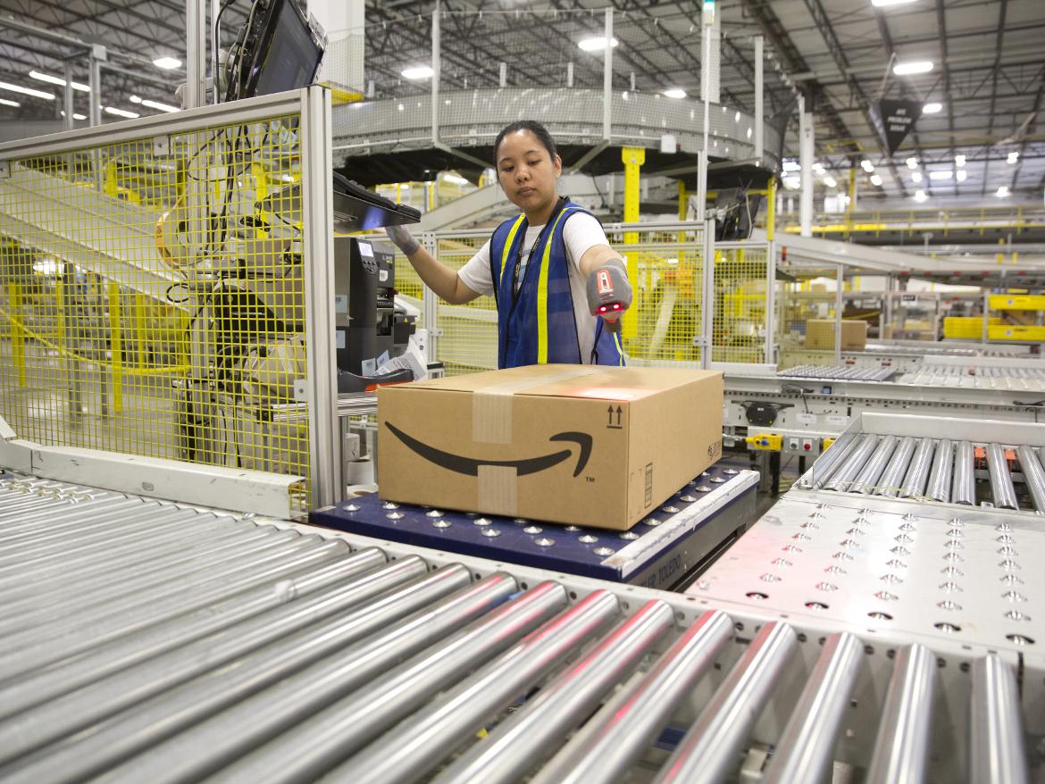 ​A worker at Amazon's shipping center in Schertz, Texas. The center includes a proprietary 