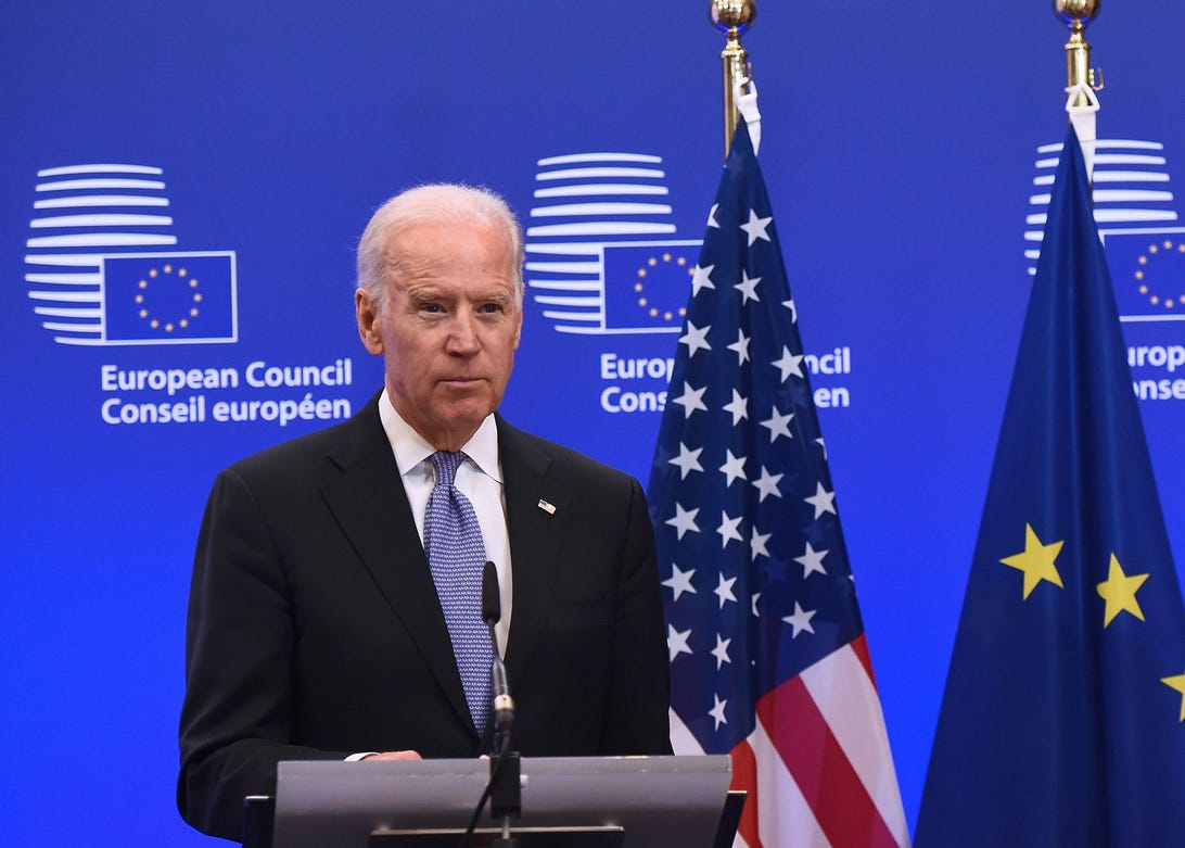 Joe Biden with US and EU flags