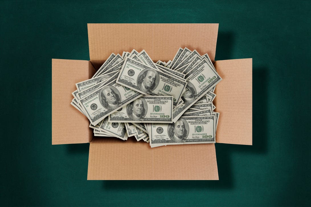 Cardboard box with hundred-dollar bills