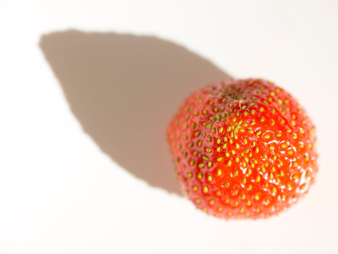 A close-up of a strawberry shot with the Phase One IQ180 digital back and 645DF camera body with the Phase One/Mamiya 120mm Macro f/4.0D lens. 1/10 sec at F9, ISO 35.