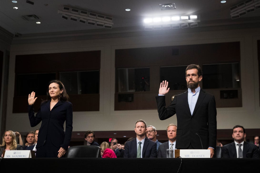 Facebook COO Sheryl Sandberg and Twitter CEO Jack Dorsey were sworn in before their testimony to the Senate intelligence committee.