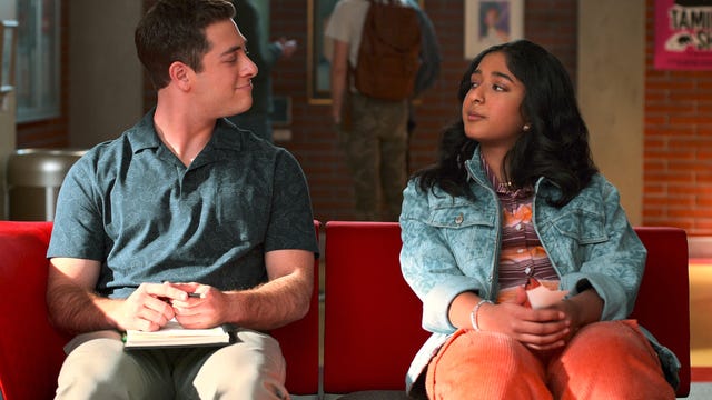 Ben sits next to Devi on a couch in Never Have I Ever
