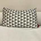 Layla Kapok pillow on a white bed