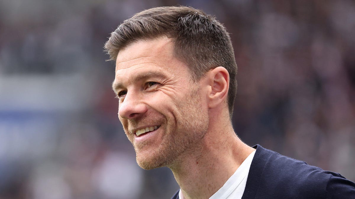 Side on image of Xabi Alonso, smiling.