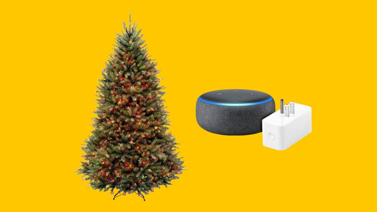 A Christmas tree, Echo Dot smart speaker and smart plug against a yellow background.