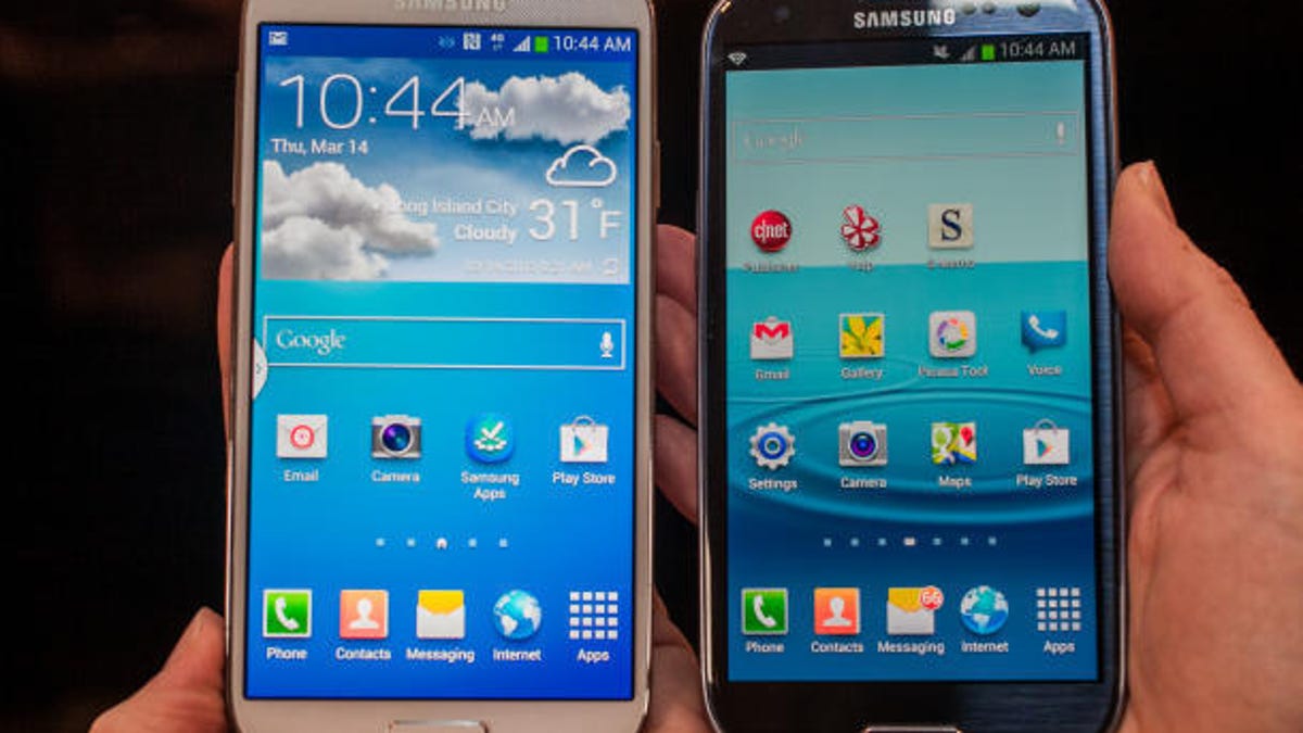 The Galaxy S4 (left) sitting alongside its predecessor (and fellow Apple target) the Galaxy S3.