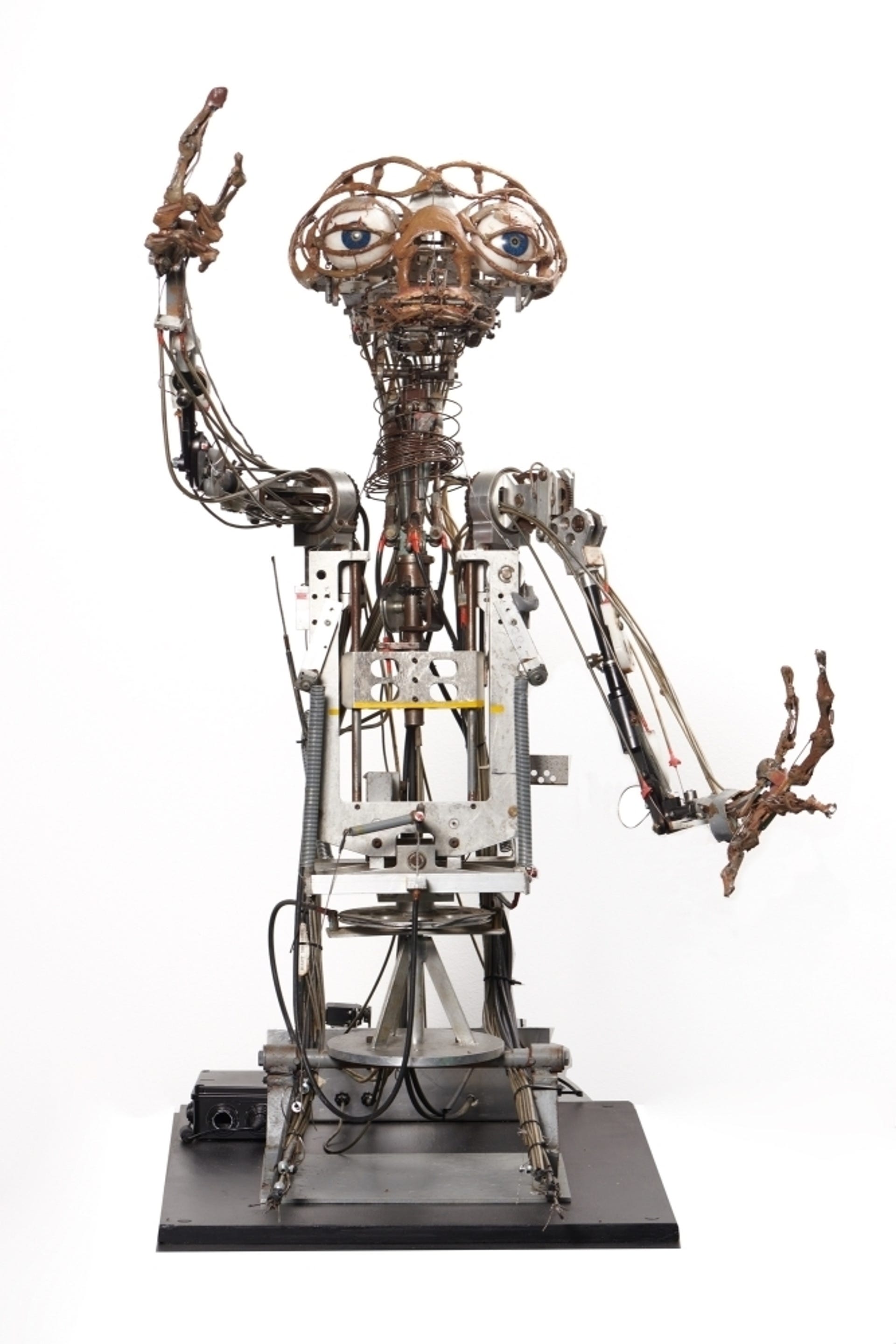 Skeletonized animatronic model of E.T. from the movie shows all the robotic components like a skin-less skeleton.