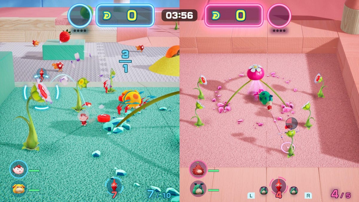 A split-screen battle in the video game Pikmin 4, with a pink and blue side to the playing field