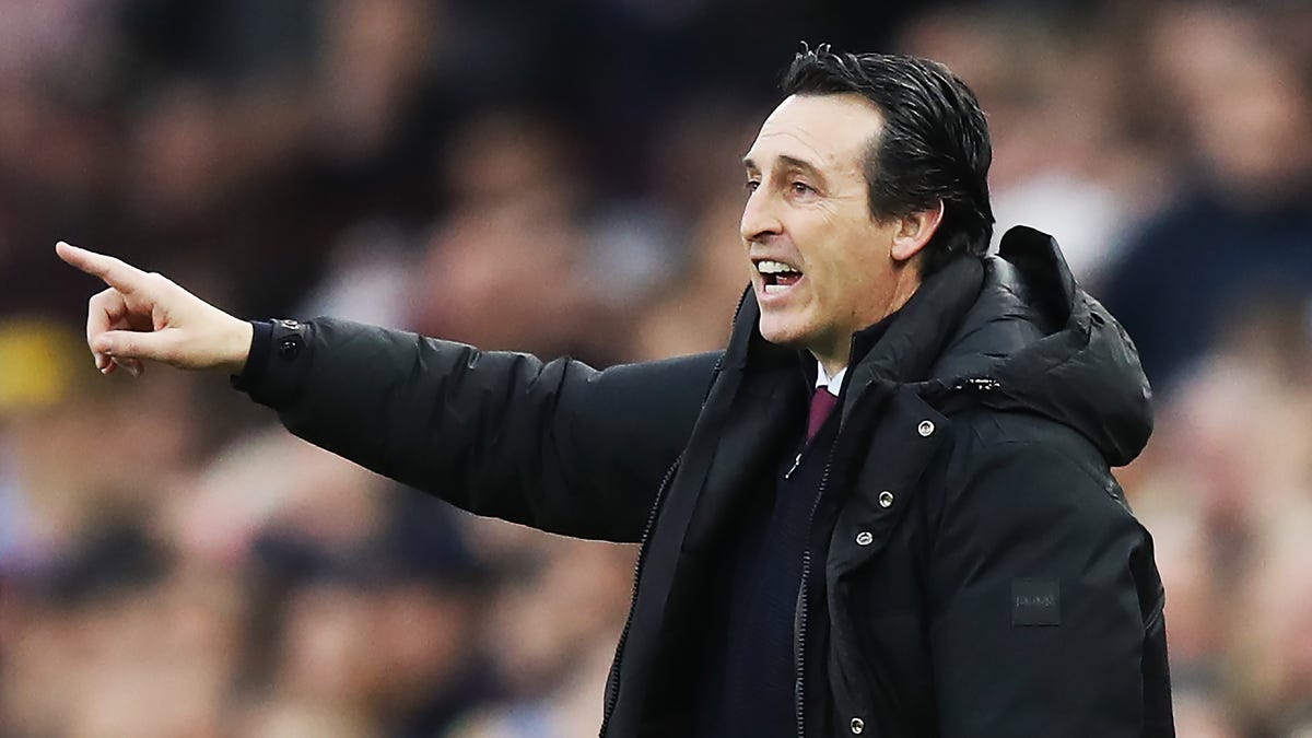 Aston Villa manager Unai Emery pointing to the left.