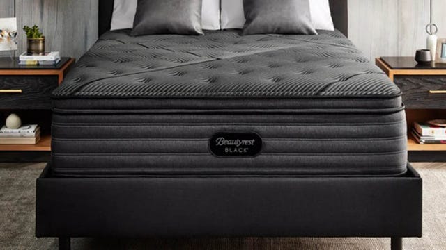 This picture is of a bed with a Beautyrest Black on top.