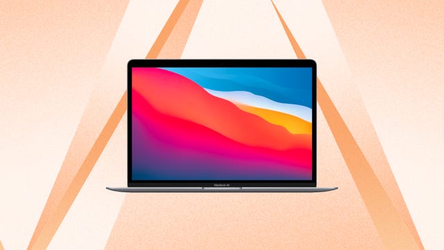 Apple MacBook Air M1 in space gray against an orange background.