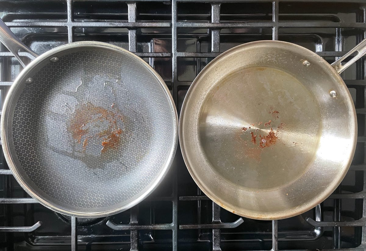 dirty hexclad pan next to stainless steel skillet
