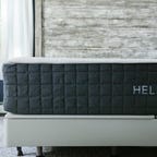 A bed with a Helix Plus mattress