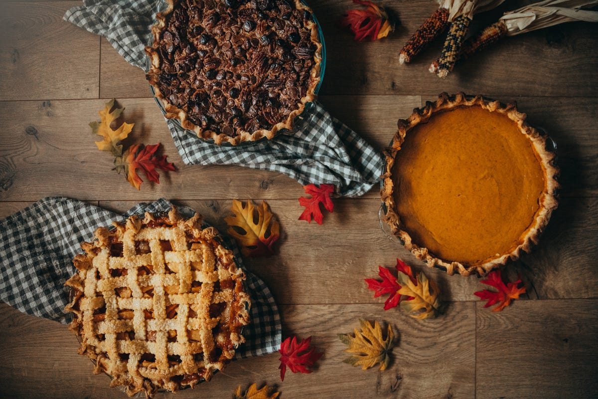 three thanksgiving pies on a table