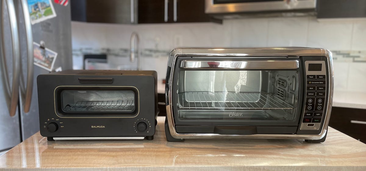 A size comparison of two toaster ovens side-by-side on a kitchen counter.