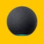 A black Amazon Echo smart speaker against a yellow background
