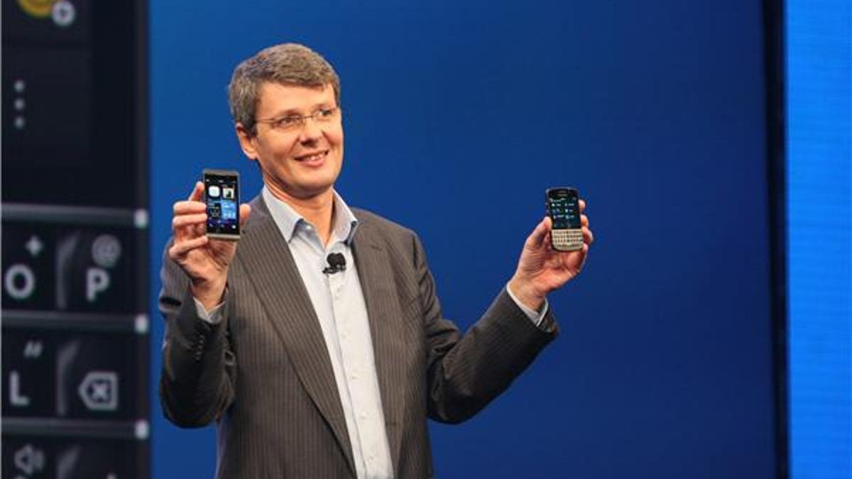 BlackBerry CEO Thorsten Heins showing off the Z10 (right) and Q10, which is launching in a few months.