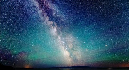 The milky way over Lake Superior with air glow and aurora borealis luminescence, taken in Grand Portage, Minnesota.