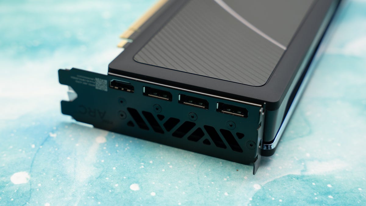 Close up of the end bracket of the A750 LE lying down against a swirling aqua and white surface showing 3 DisplayPort and one HDMI connector