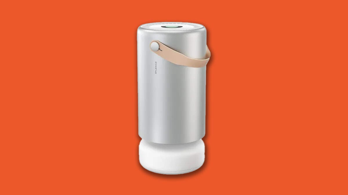 The Molekule Air Pro air purifier against an orange background.