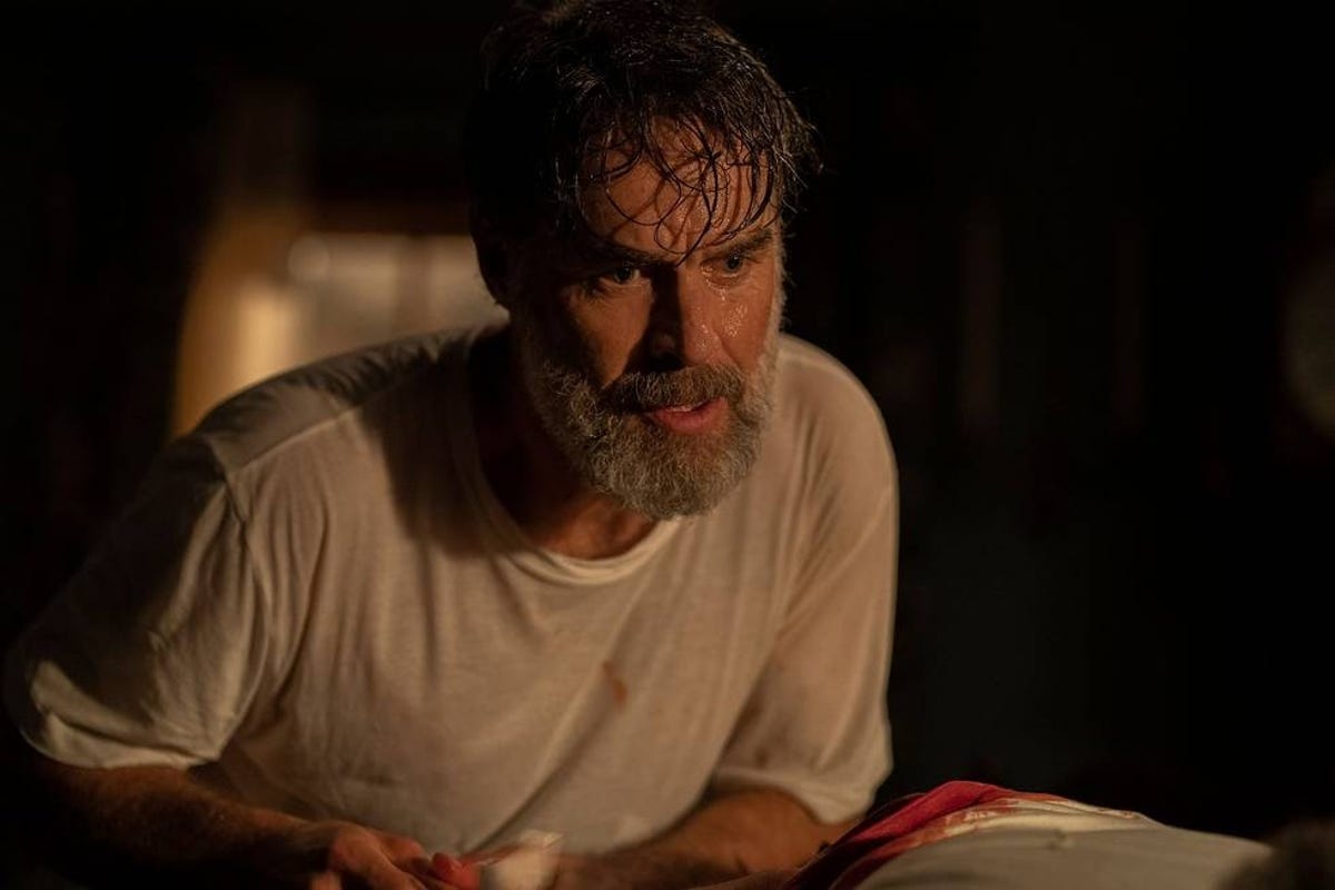 Wet Murray Bartlett with a concerned look as Frank in The Last of Us Episode 4