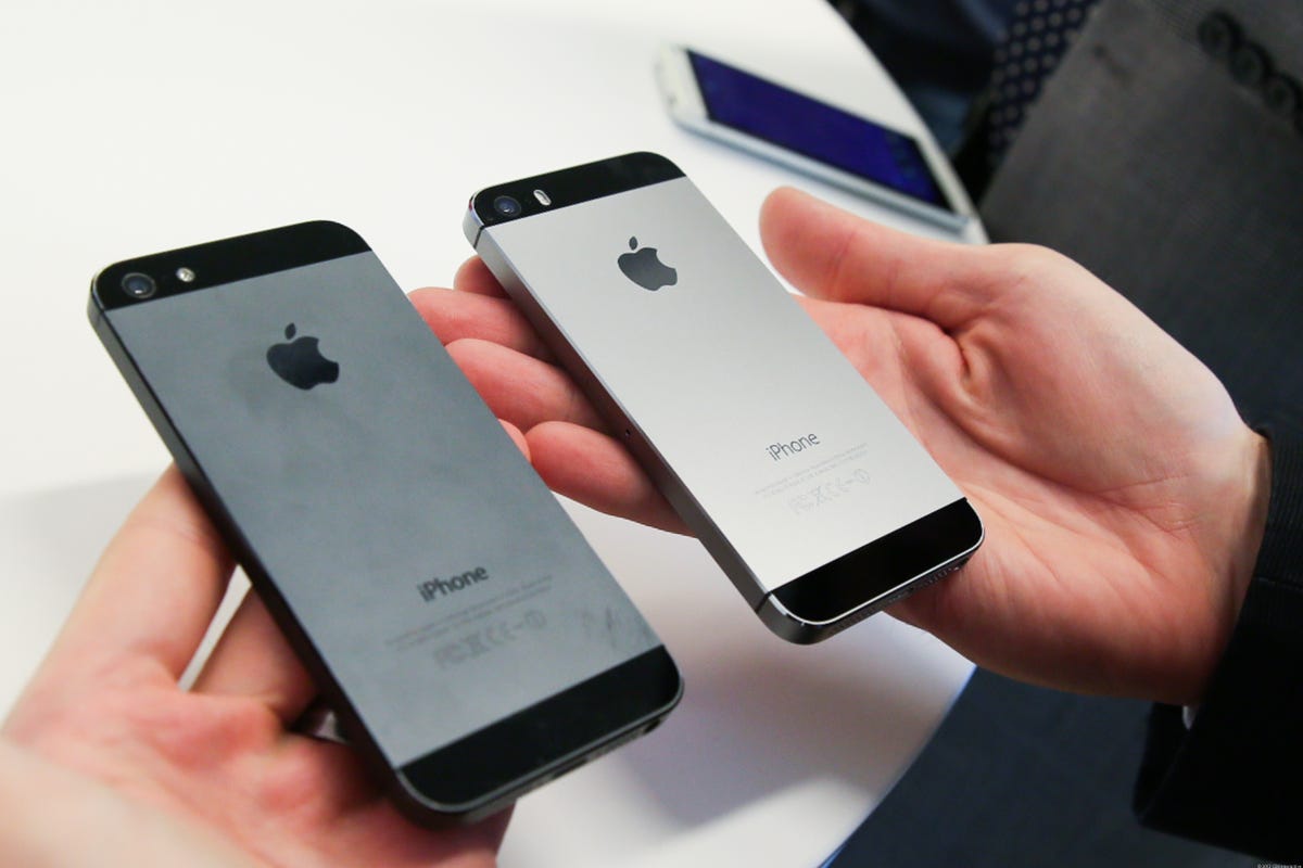 The iPhone 5, left, and 5S in space gray.
