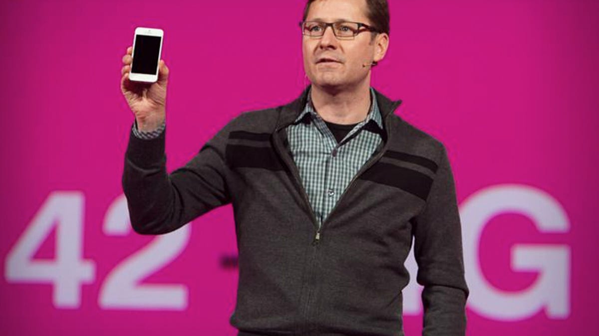 T-Mobile's Chief Marketing Officer Mike Sievert holds aloft the long-awaited T-Mobile iPhone 5 at an event in New York March 26, 2013.