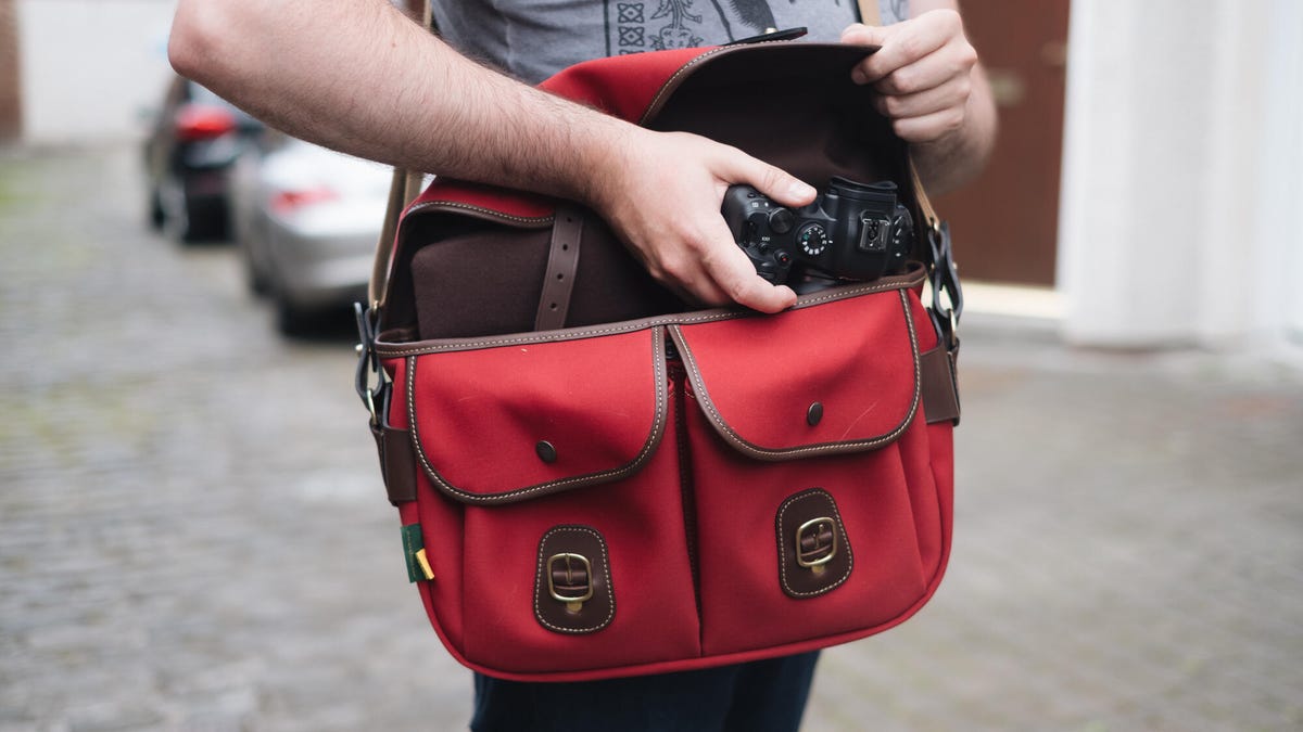 A person wearing a photography bag
