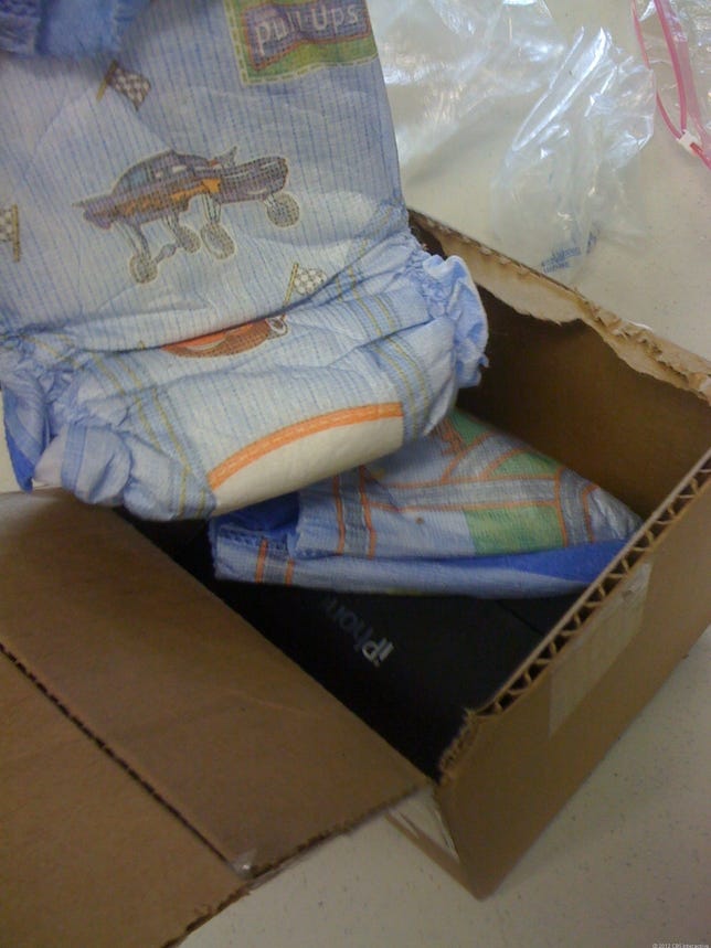 A used iPhone box padded with diapers sent in to Gazelle.