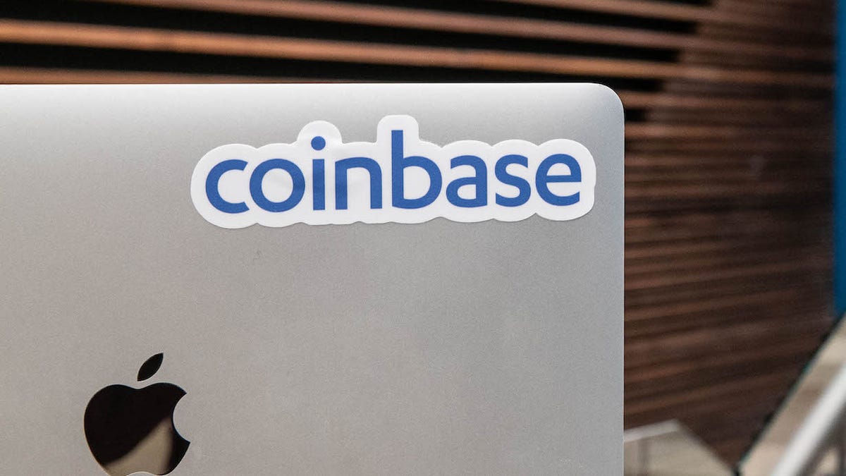 Coinbase sticker on an Apple laptop