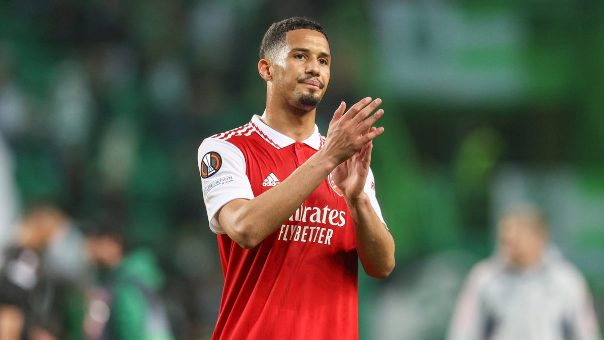 Arsenal defender William Saliba clapping his hands.