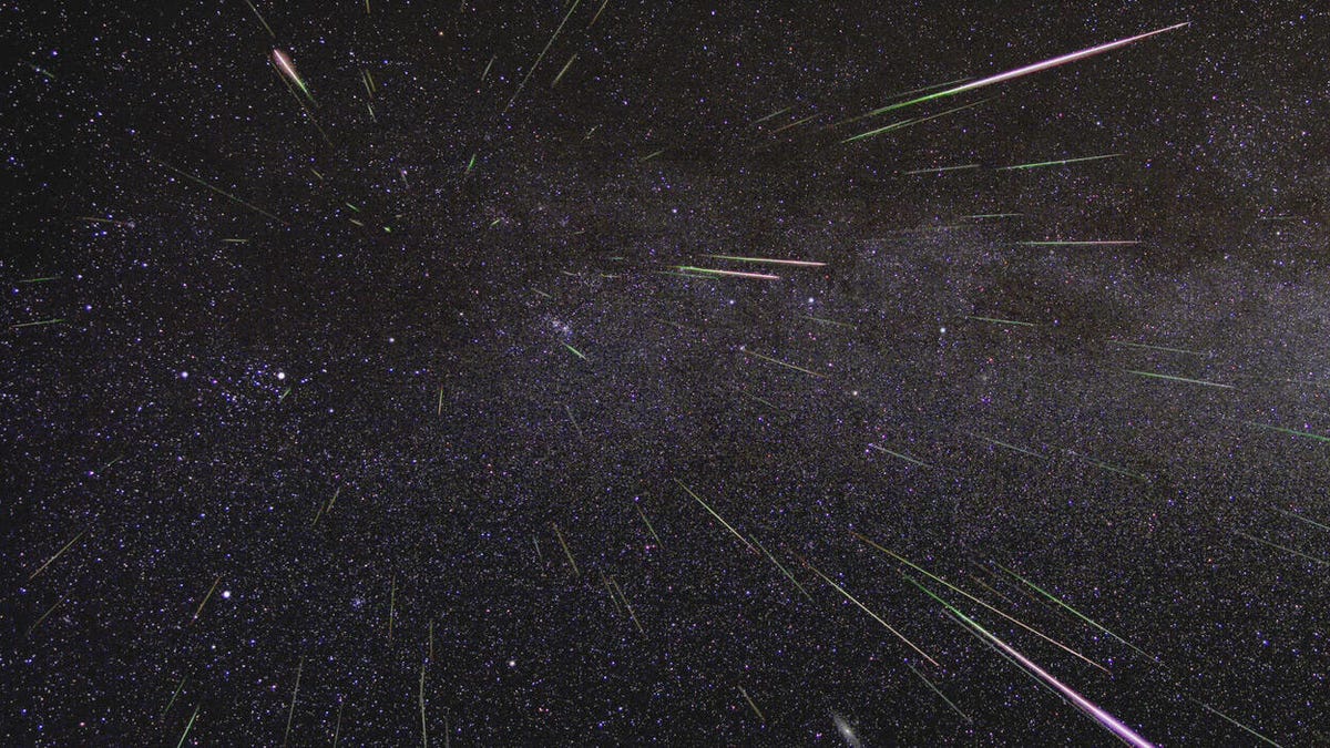 Meteors streaking across the night sky