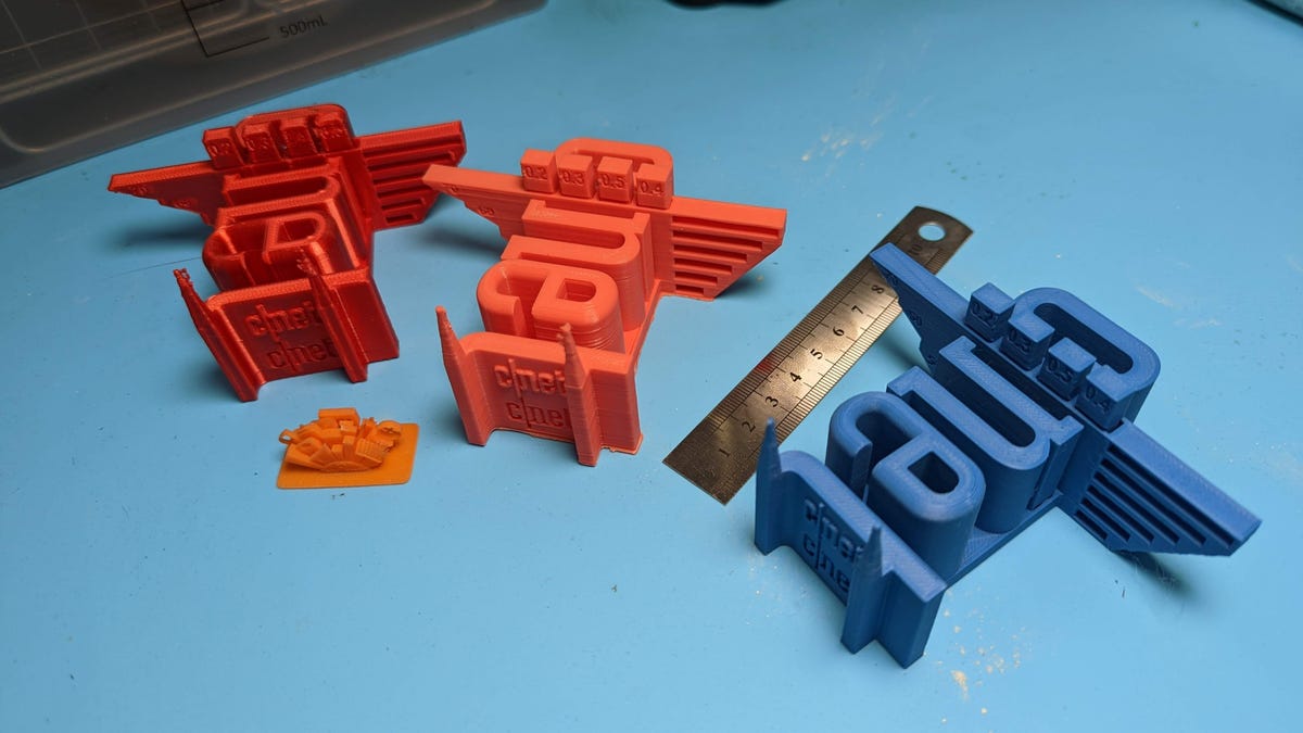 Four 3D printed models that show 3D printing errors